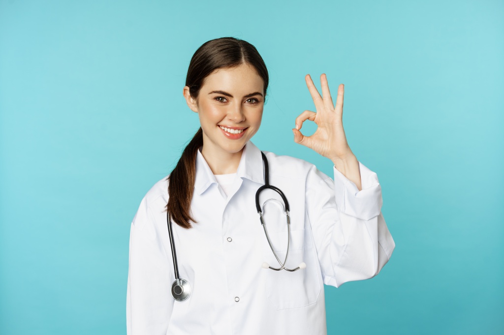 portrait-satisfied-smiling-medical-worker-woman-doctor-showing-okay-ok-zero-no-problem-gesture-ex.jpg